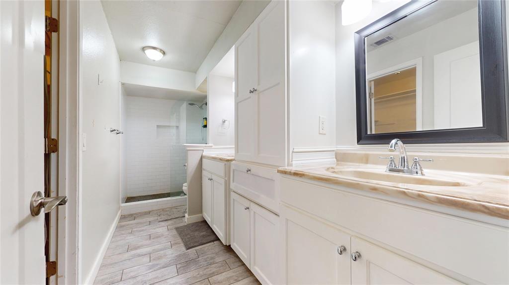 411 Sycamore Creek Road Allen, TX 75002 - Photo 22 of 36 a spacious bathroom with a double vanity sink and mirror