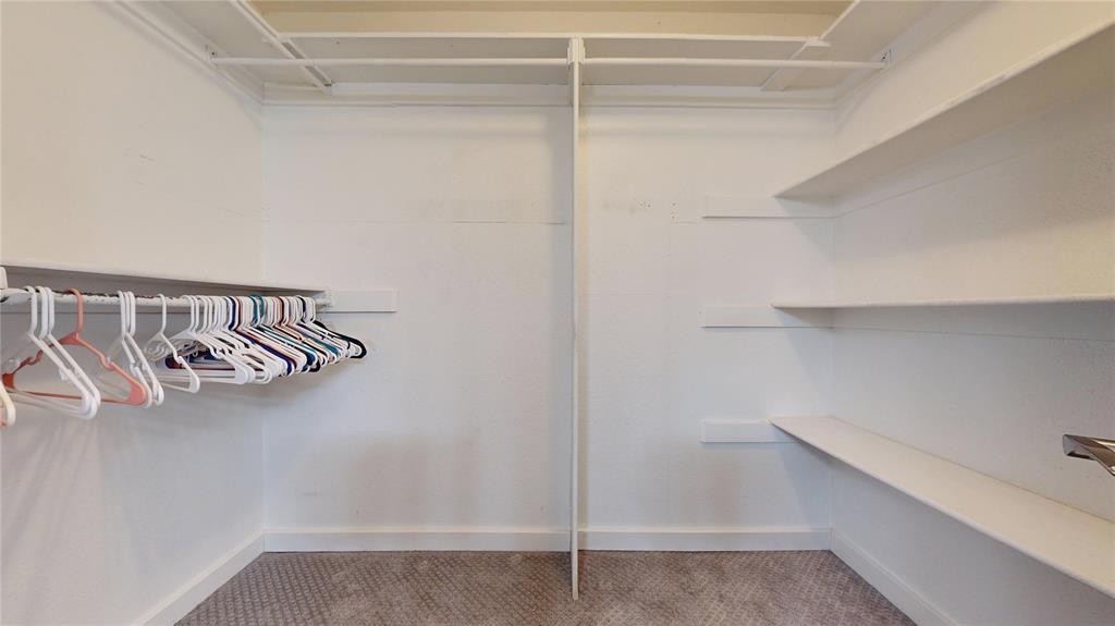 411 Sycamore Creek Road Allen, TX 75002 - Photo 24 of 36 a view of walk in closet with empty racks