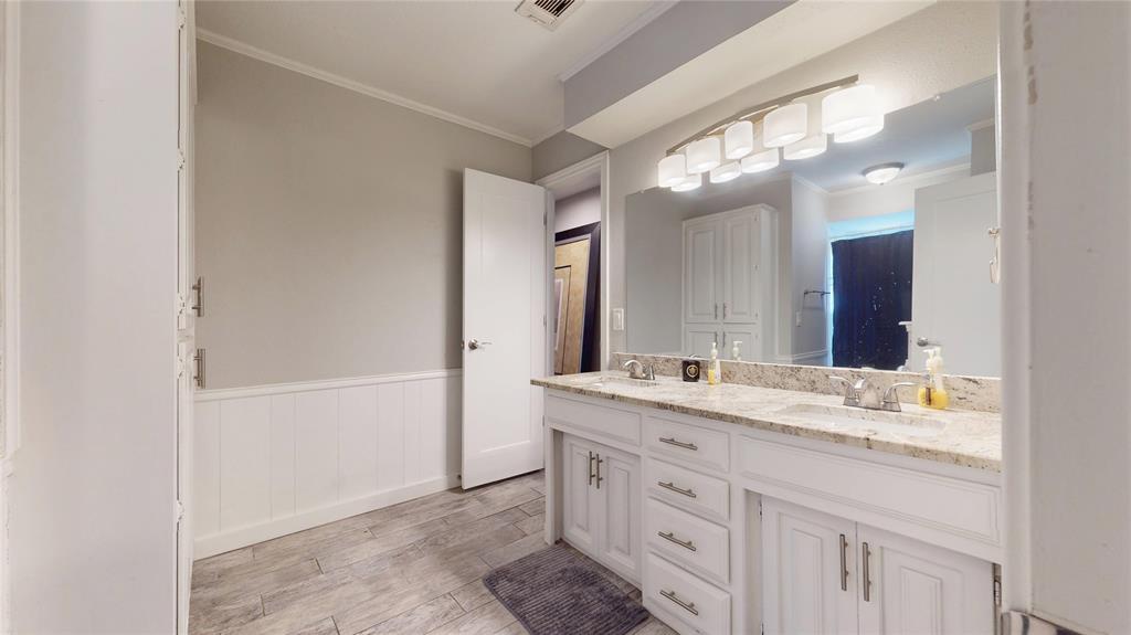 411 Sycamore Creek Road Allen, TX 75002 - Photo 27 of 36 a bathroom with a sink and a mirror