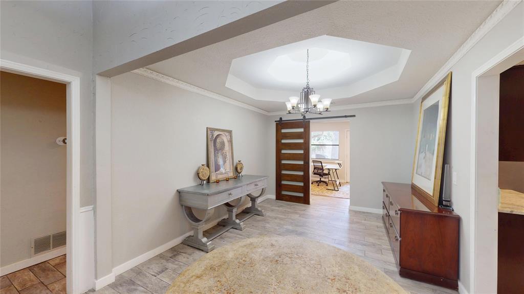 411 Sycamore Creek Road Allen, TX 75002 - Photo 30 of 36 a view of a livingroom with a piano and a chandelier