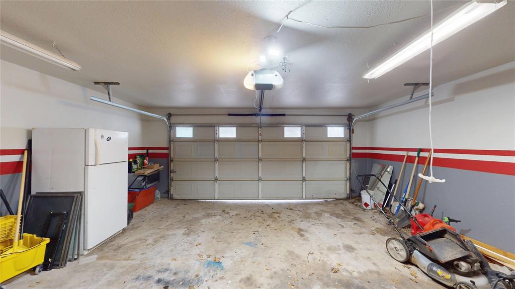 411 Sycamore Creek Road Allen, TX 75002 - Photo 31 of 36 a view of a garage with storage