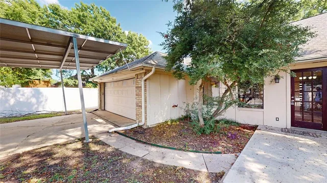 a bed with white sheets and a blanket