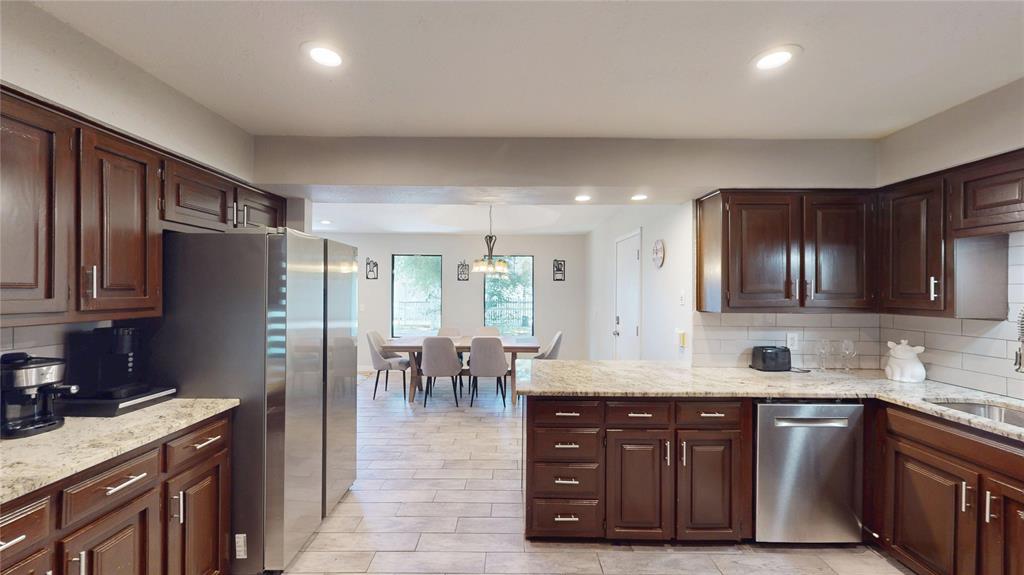 411 Sycamore Creek Road Allen, TX 75002 - Photo 4 of 36 a kitchen with lots of counter top space