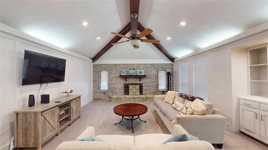411 Sycamore Creek Road Allen, TX 75002 - Photo 6 of 36 a living room with furniture and a flat screen tv