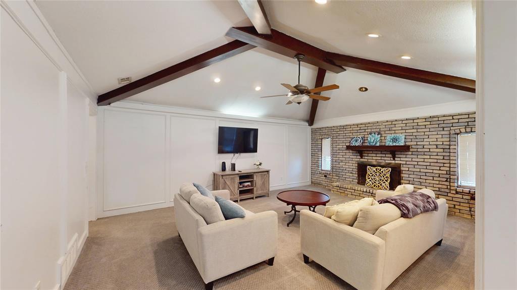 411 Sycamore Creek Road Allen, TX 75002 - Photo 9 of 36 a living room with furniture and a flat screen tv