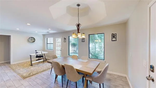 a dining room with furniture and window