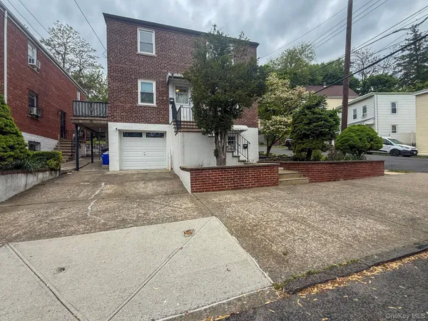 a view of a house with a street