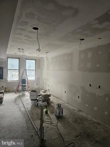 a view of an empty room with windows