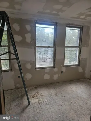 a view of a hallway with closet