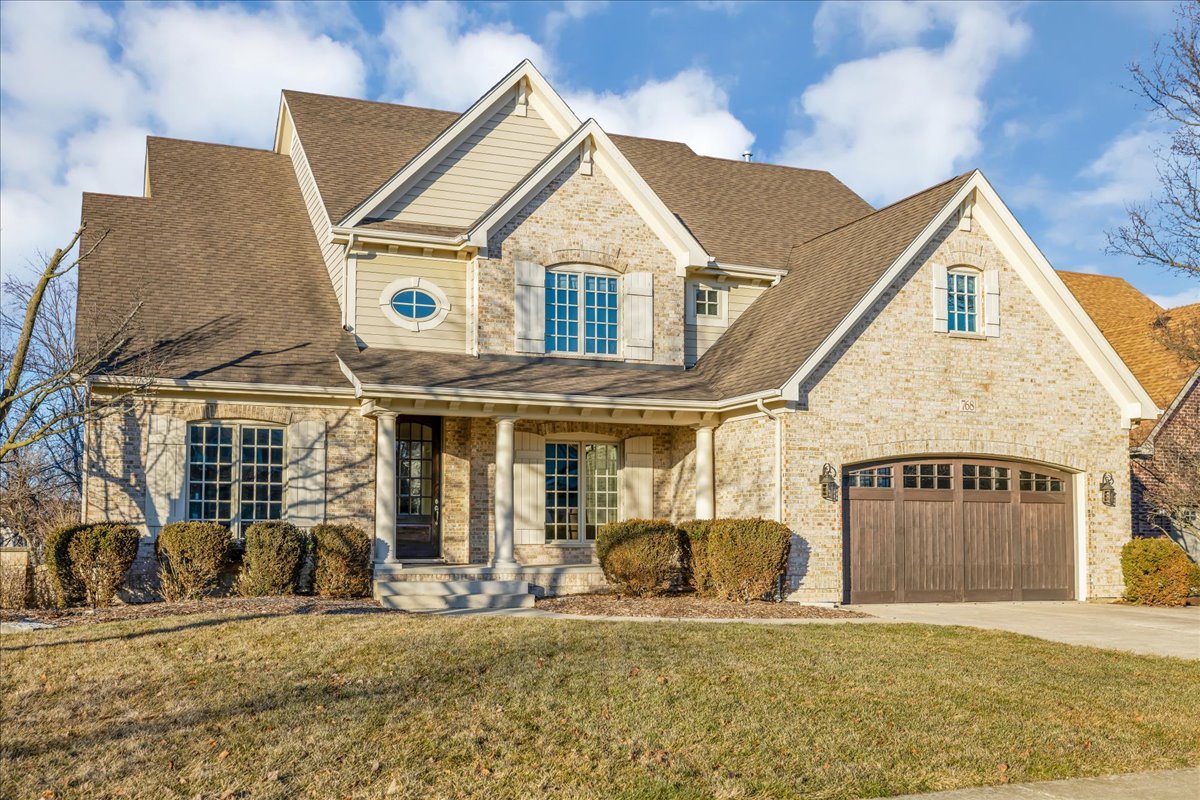 768 Wild Ginger Road Sugar Grove, IL 60554 - Photo 1 of 40 a front view of a house with garden