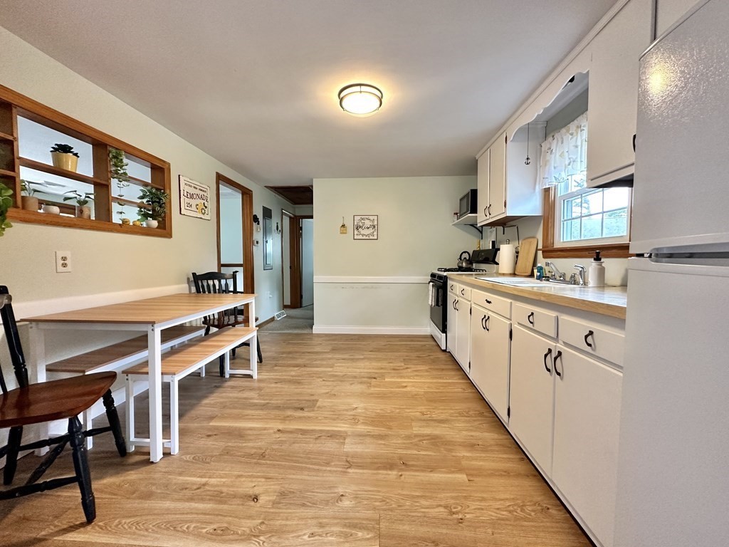 101 Swan River Road Dennis, MA 02670 - Photo 11 of 19 a kitchen with stainless steel appliances lots of counter top space and furniture