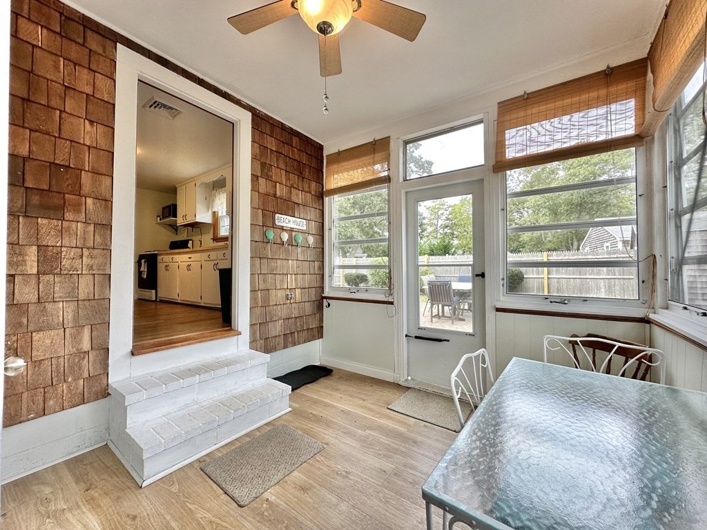 101 Swan River Road Dennis, MA 02670 - Photo 9 of 19 a living room with furniture and a large window