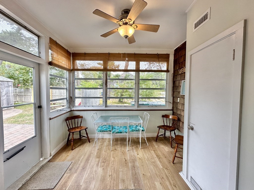 101 Swan River Road Dennis, MA 02670 - Photo 10 of 19 a living room with furniture and a large window