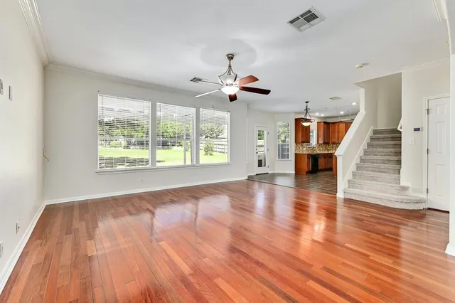 a view of a livingroom with wooden floor