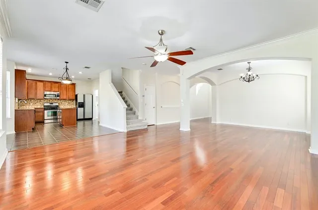 a view of livingroom with hardwood floor and a ceiling fan