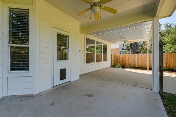 a view of a house with backyard and porch