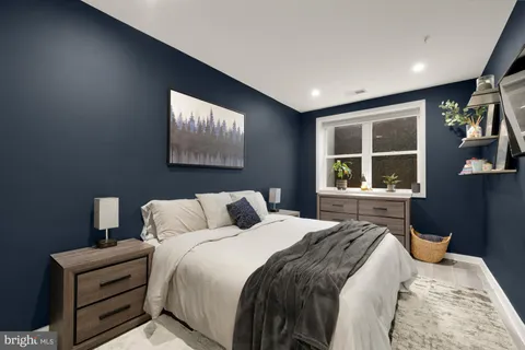 a bedroom with bed and window