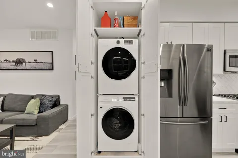 a kitchen with a refrigerator and cabinets