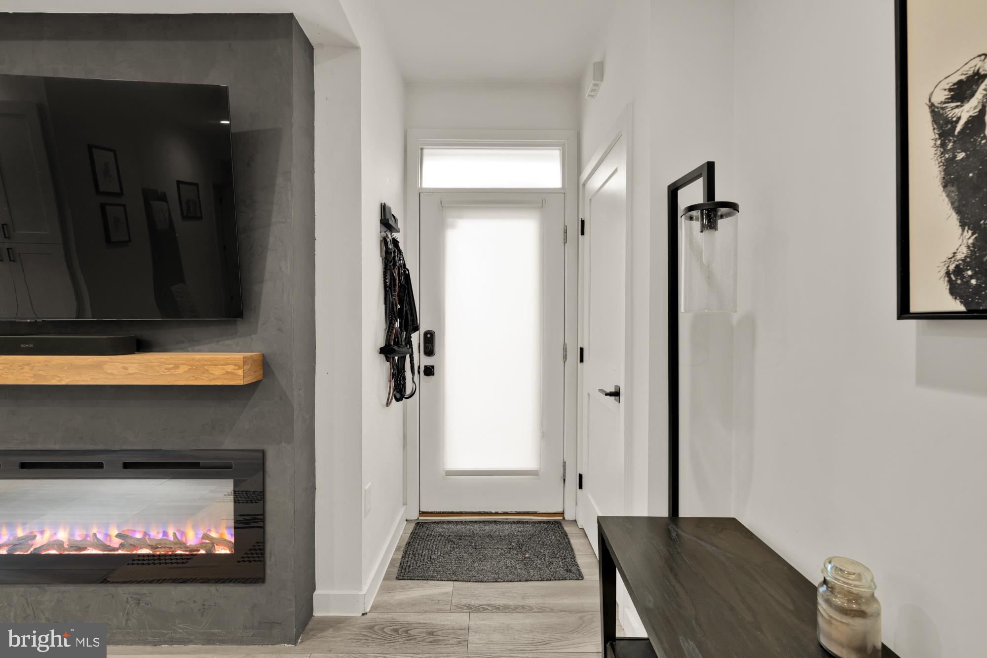 4816 3rd Street Northwest, Unit 2 Washington, DC 20011 - Photo 9 of 35 a view of a livingroom with wooden floor and a fireplace