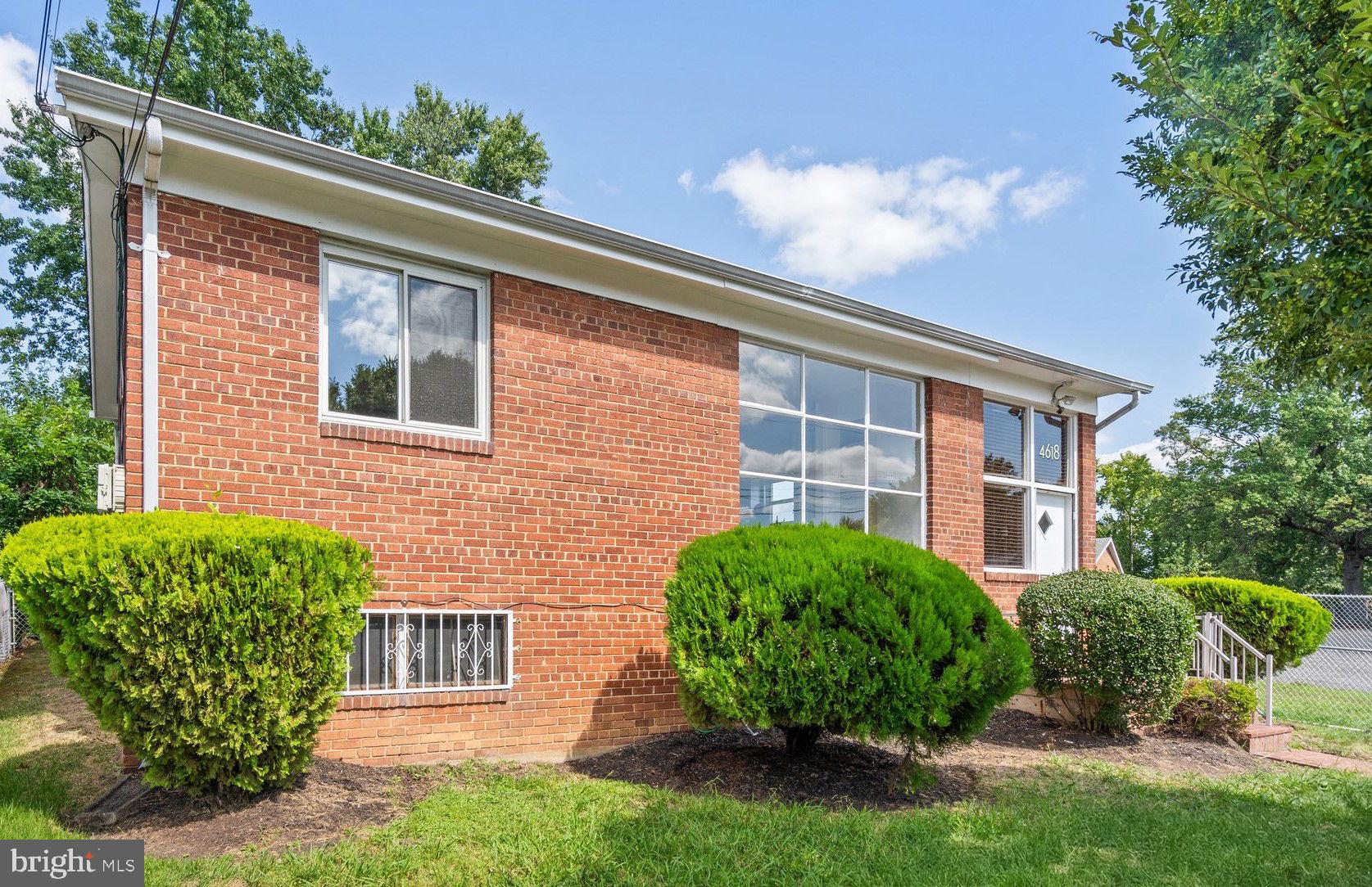 a view of an house with backyard space and garden