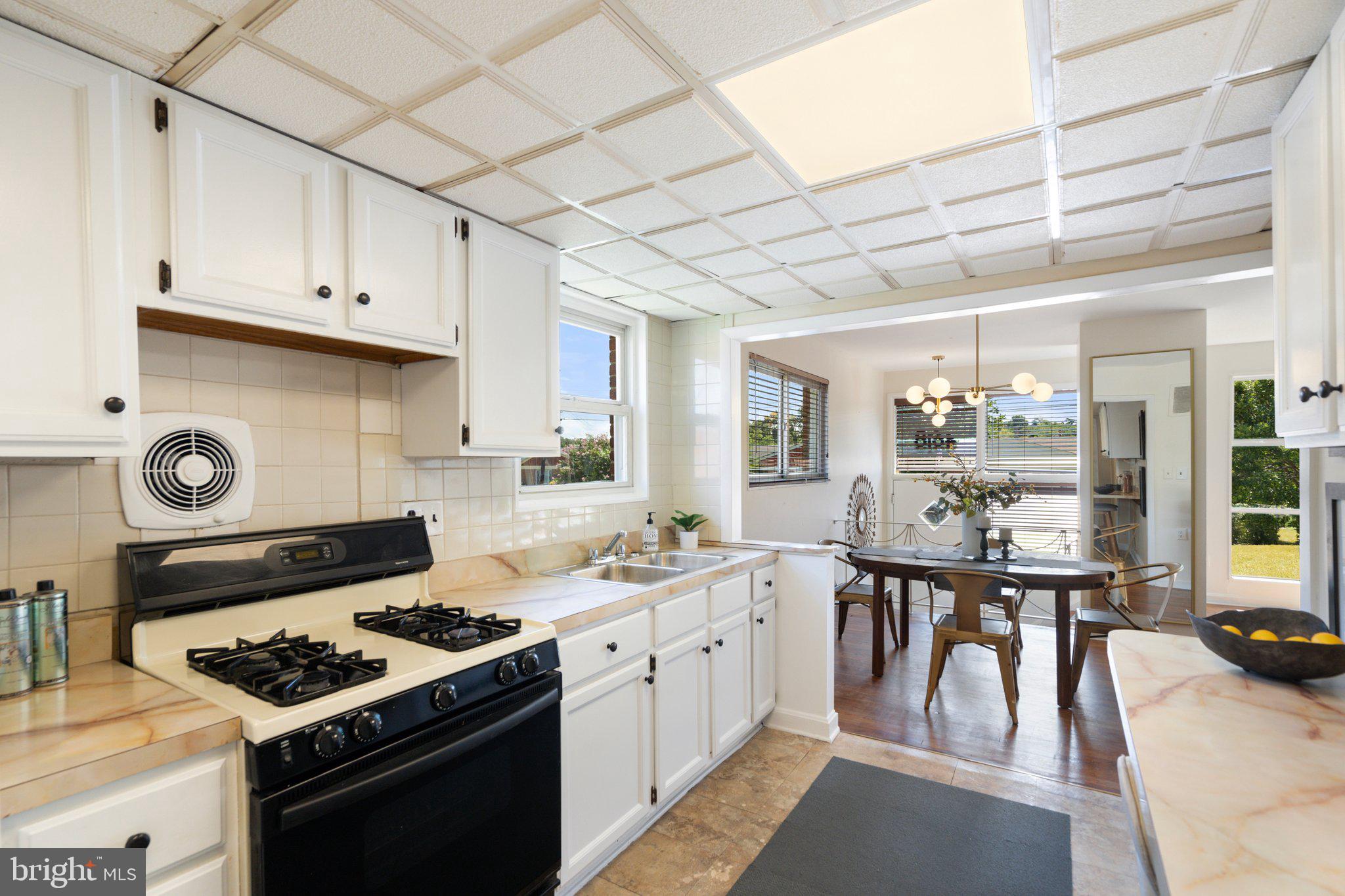 4618 Hilltop Terrace Southeast Washington, DC 20019 - Photo 12 of 36 a kitchen with a stove and a sink