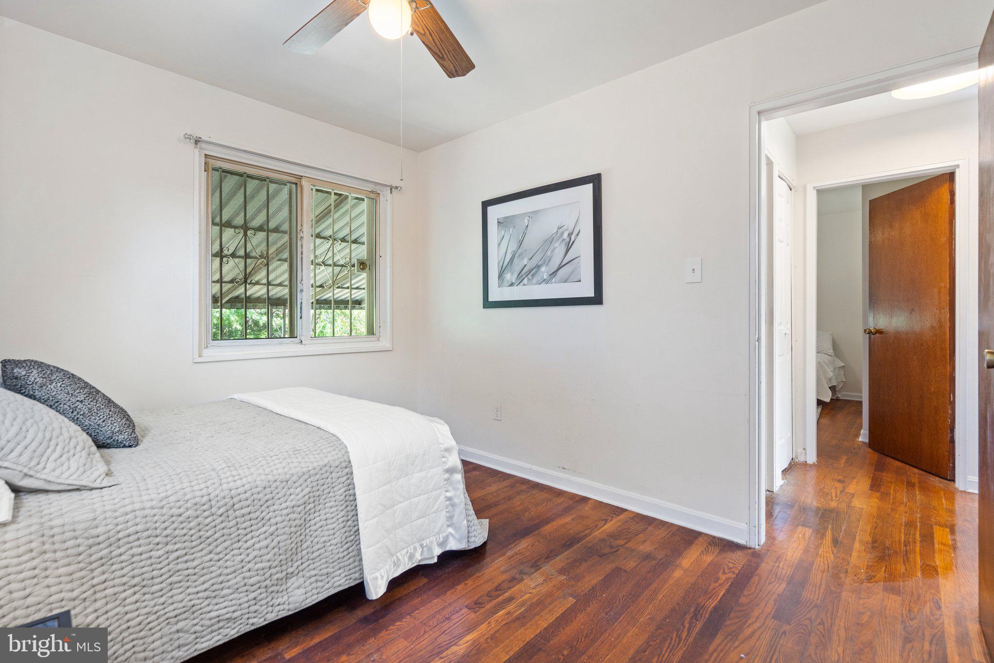 4618 Hilltop Terrace Southeast Washington, DC 20019 - Photo 17 of 36 a bedroom with a bed and a window