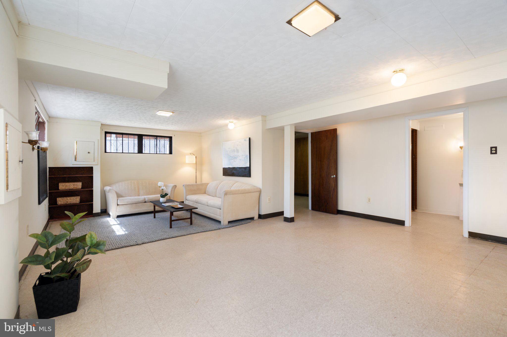 4618 Hilltop Terrace Southeast Washington, DC 20019 - Photo 20 of 36 a living room with furniture and a white couch