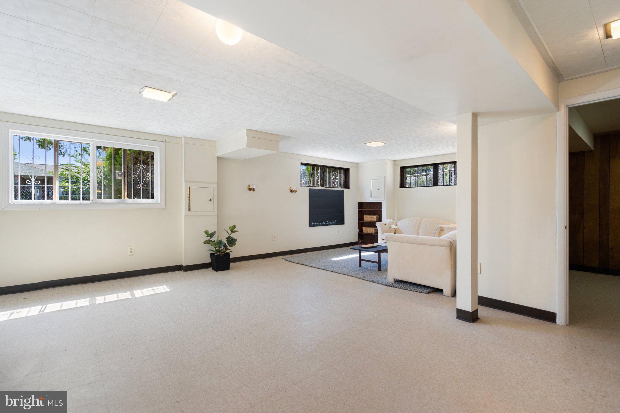 4618 Hilltop Terrace Southeast Washington, DC 20019 - Photo 21 of 36 a view of a room with gym equipment and windows