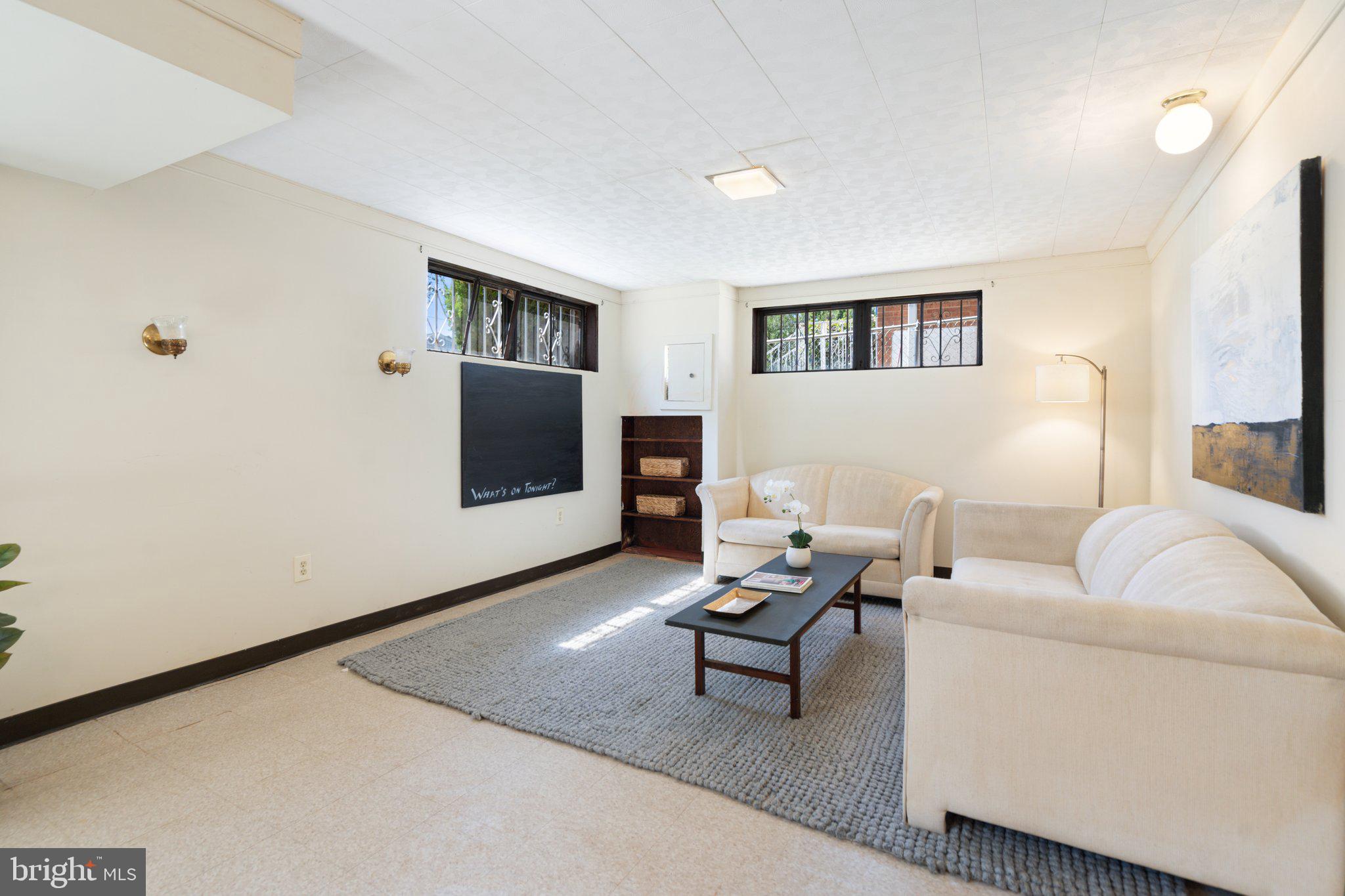 4618 Hilltop Terrace Southeast Washington, DC 20019 - Photo 22 of 36 a living room with furniture and a flat screen tv
