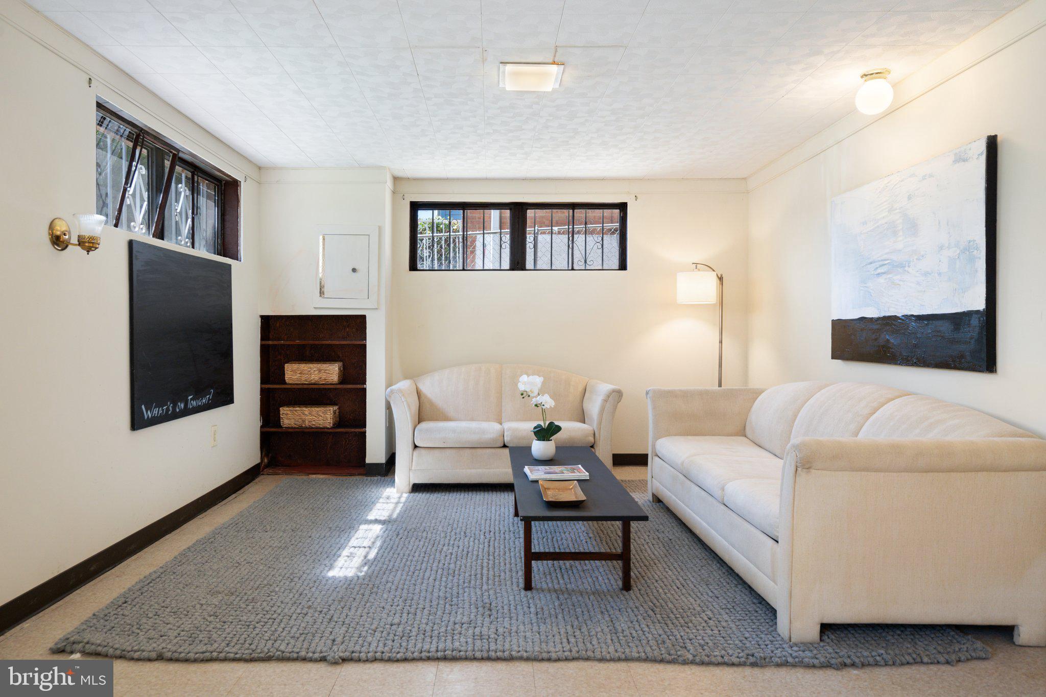 4618 Hilltop Terrace Southeast Washington, DC 20019 - Photo 23 of 36 a living room with furniture and a flat screen tv
