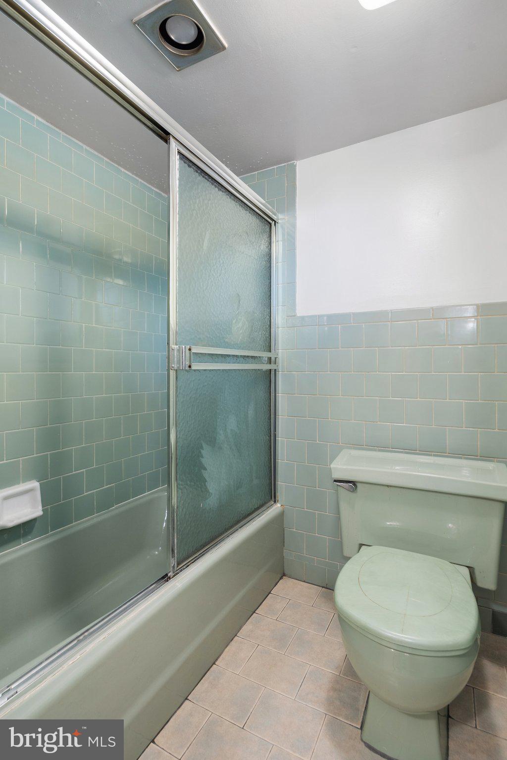 4618 Hilltop Terrace Southeast Washington, DC 20019 - Photo 26 of 36 a bathroom with a toilet and a shower