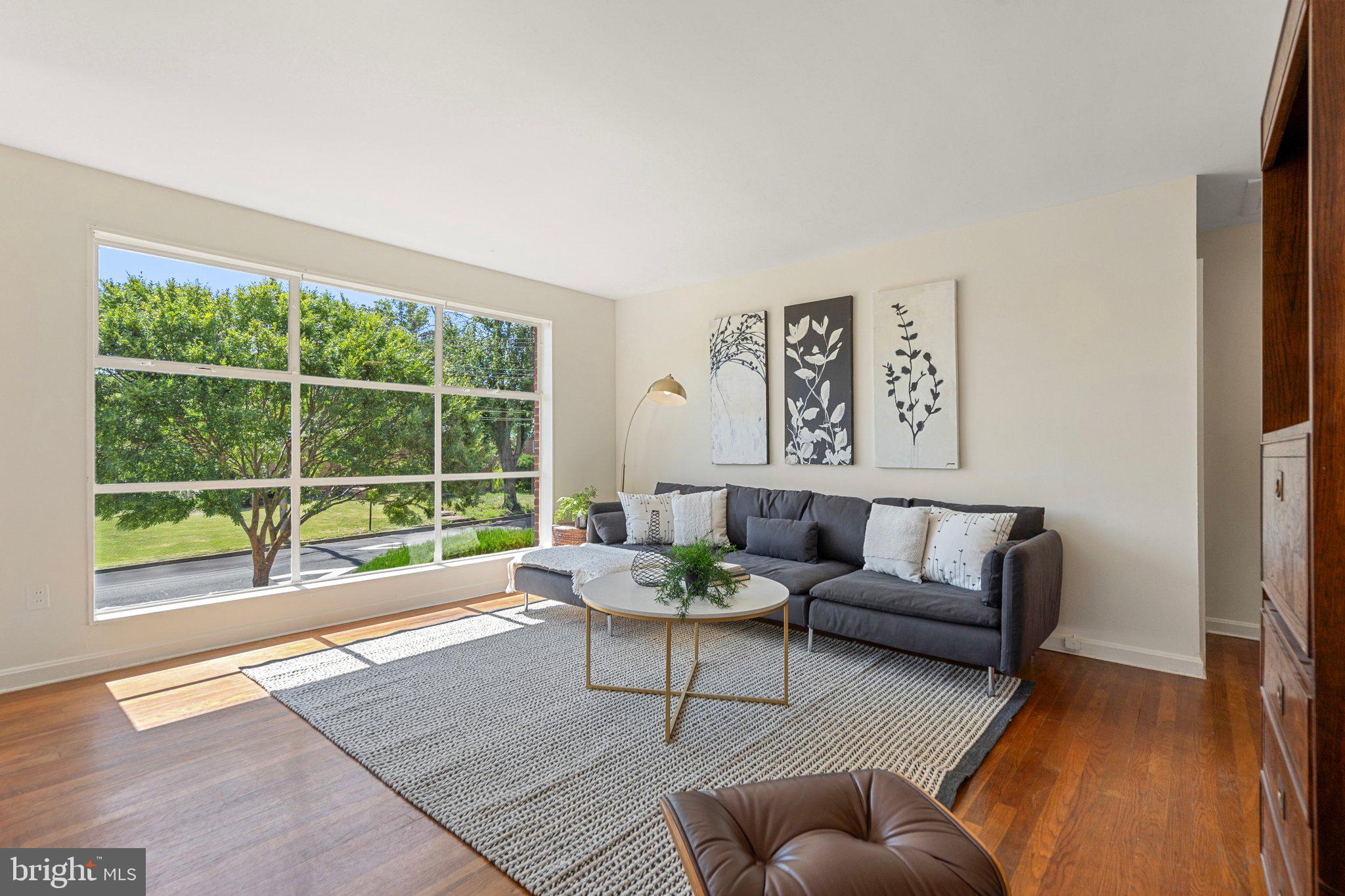 4618 Hilltop Terrace Southeast Washington, DC 20019 - Photo 4 of 36 a living room with furniture and a large window