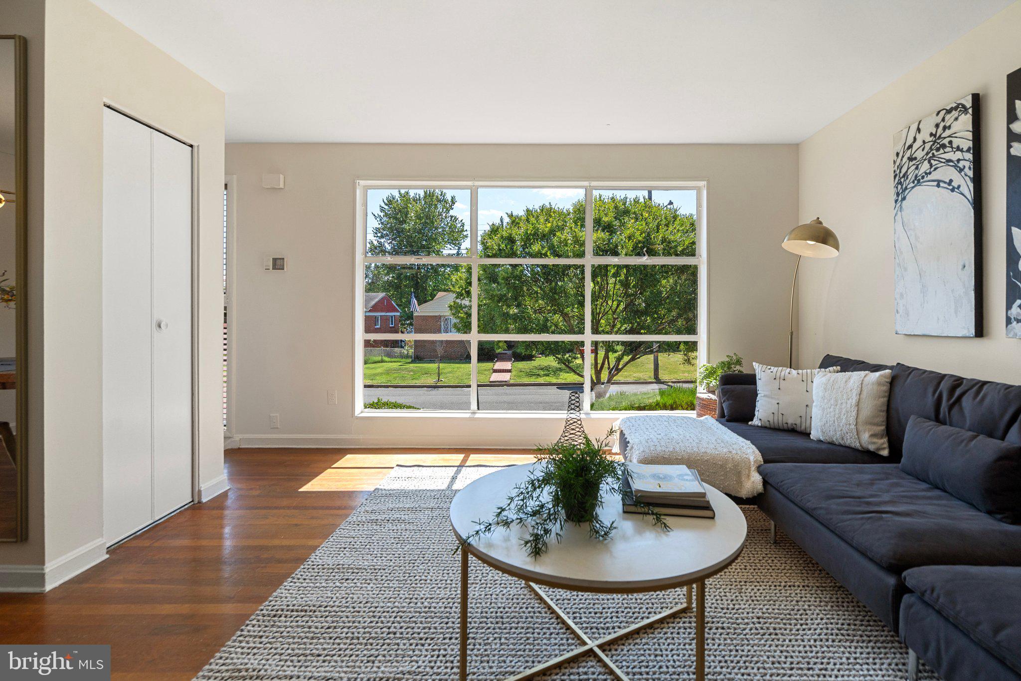 4618 Hilltop Terrace Southeast Washington, DC 20019 - Photo 6 of 36 a living room with furniture and a window
