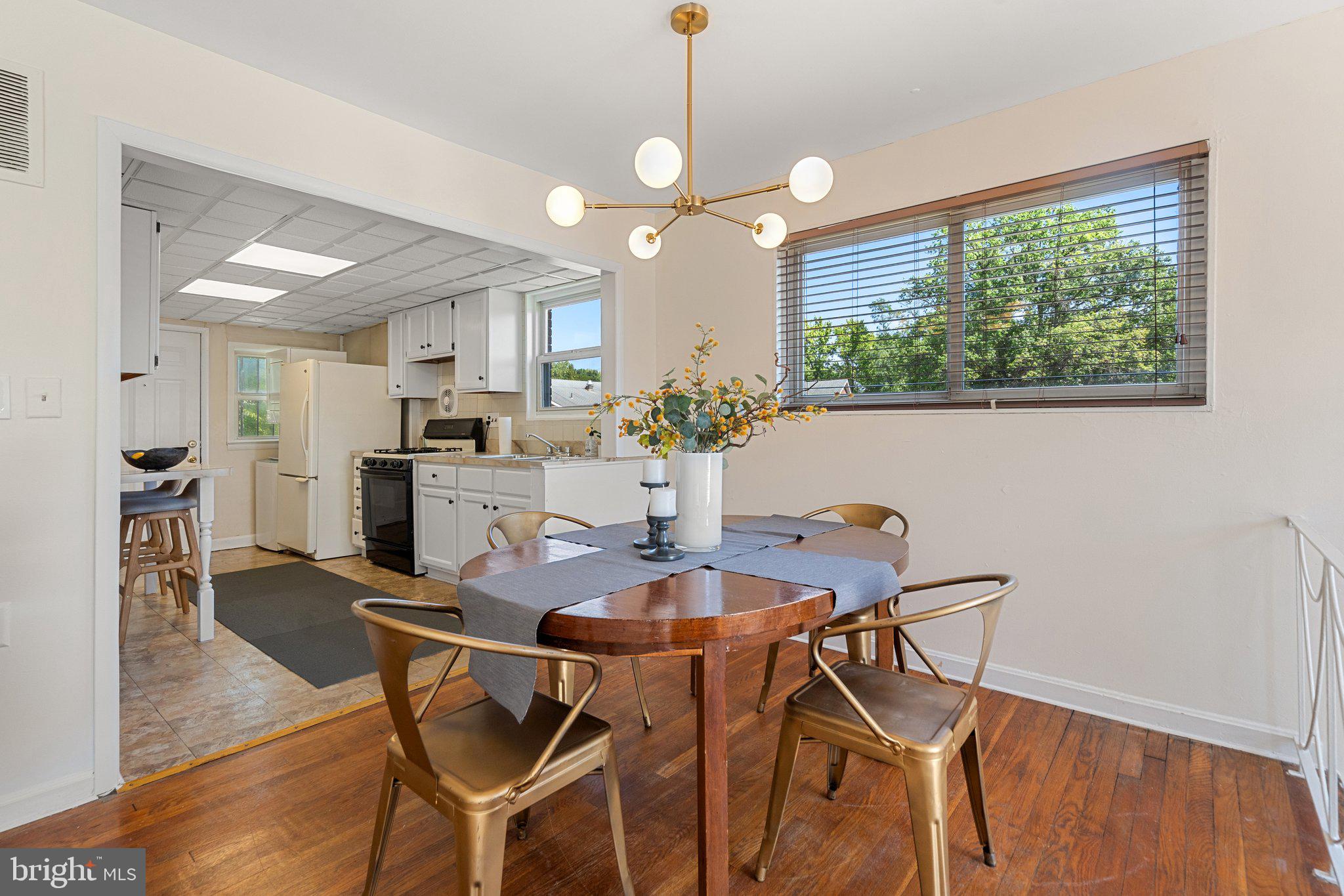 4618 Hilltop Terrace Southeast Washington, DC 20019 - Photo 8 of 36 a view of a dining room with furniture window and wooden floor