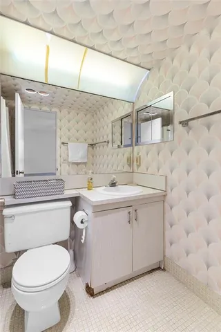 a view of an entryway and hall with a dining table & chairs