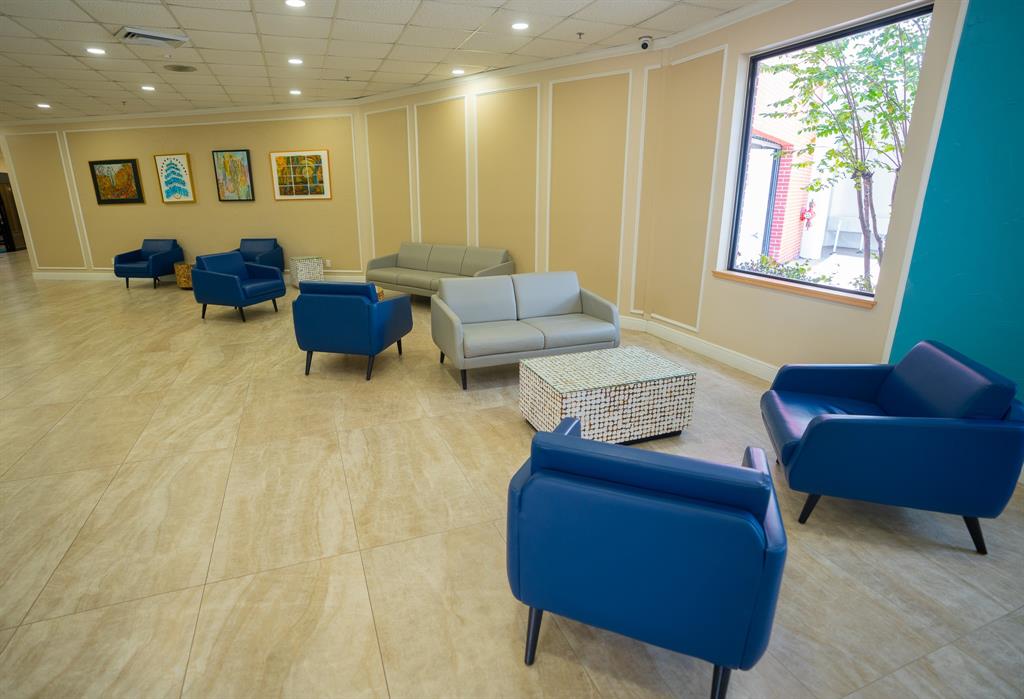 4047 Cambridge C, Unit 4047 Deerfield Beach, FL 33442 - Photo 29 of 43 a living room with furniture and a window