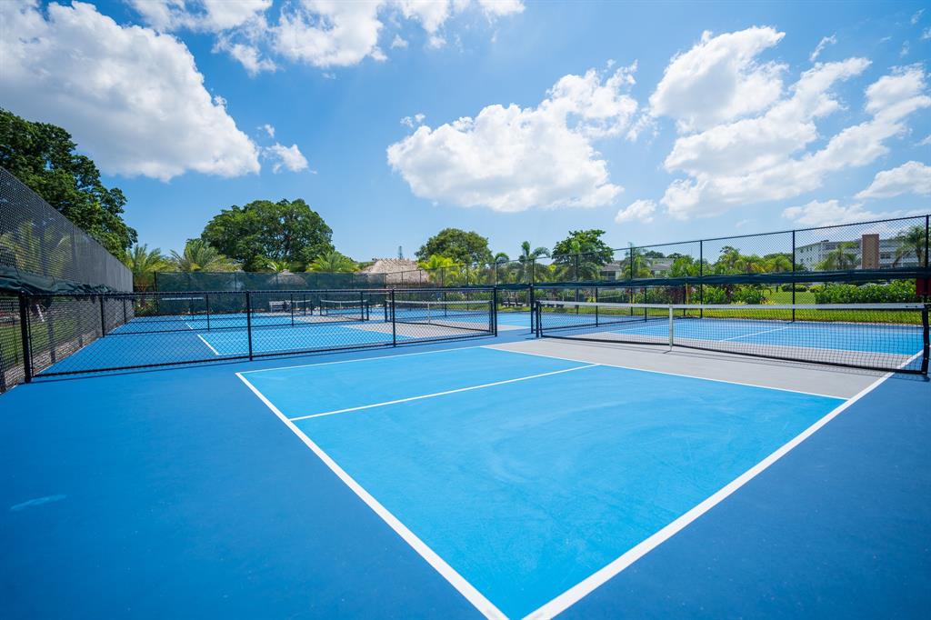 4047 Cambridge C, Unit 4047 Deerfield Beach, FL 33442 - Photo 36 of 43 a view of a tennis court