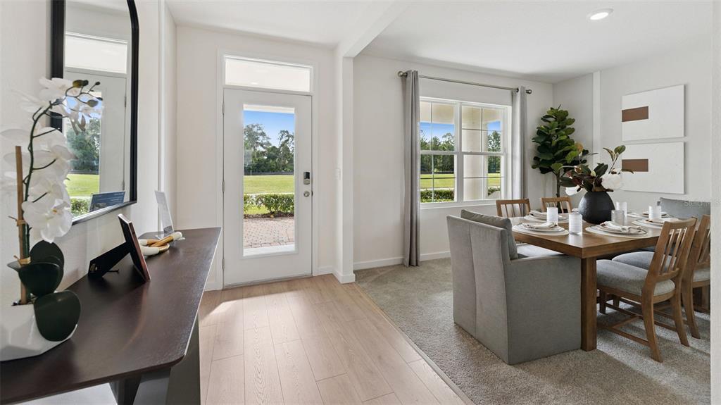 5289 Masser Road St. Cloud, FL 34772 - Photo 2 of 24 a dining room with furniture and wooden floor