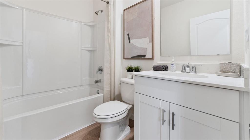 5289 Masser Road St. Cloud, FL 34772 - Photo 21 of 24 a bathroom with a sink a toilet and shower