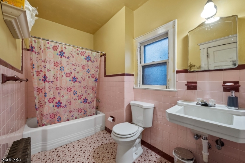 150 Jefferson Street Paterson, NJ 07522 - Photo 11 of 31 a bathroom with a sink toilet and shower