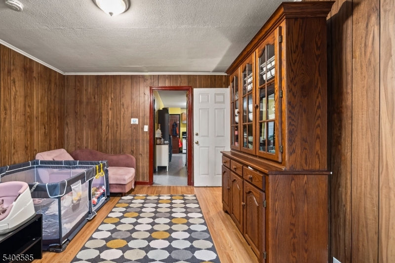 150 Jefferson Street Paterson, NJ 07522 - Photo 14 of 31 a room with furniture a rug and a window