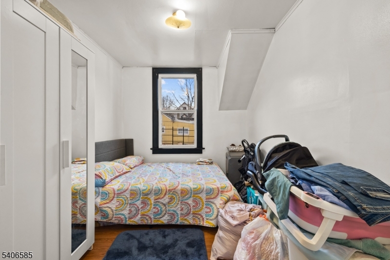 150 Jefferson Street Paterson, NJ 07522 - Photo 19 of 31 a bedroom with bed and a window