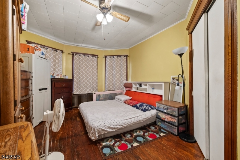 150 Jefferson Street Paterson, NJ 07522 - Photo 4 of 31 a living room with furniture a rug and a chandelier