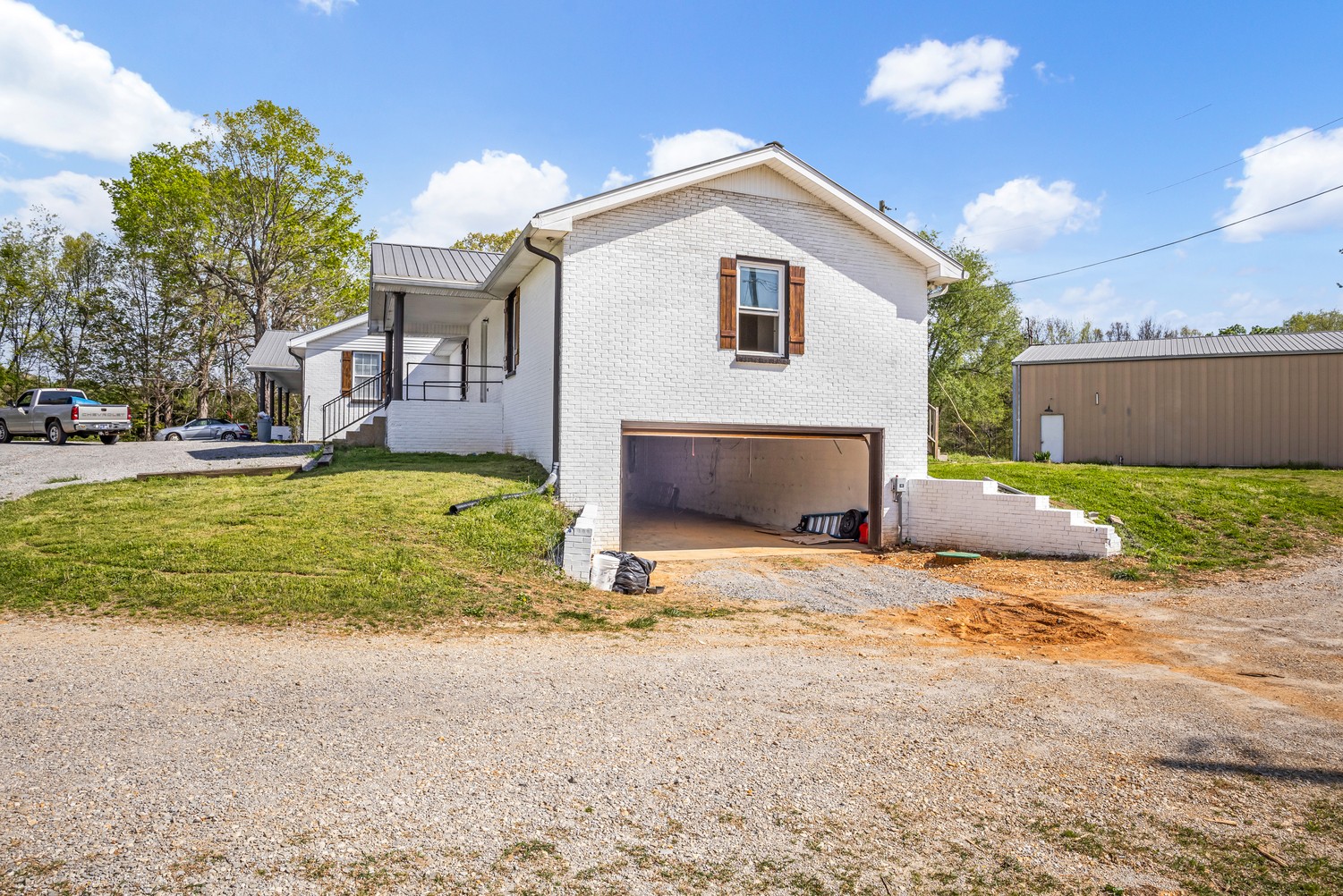 a view of a house with a yard and garage