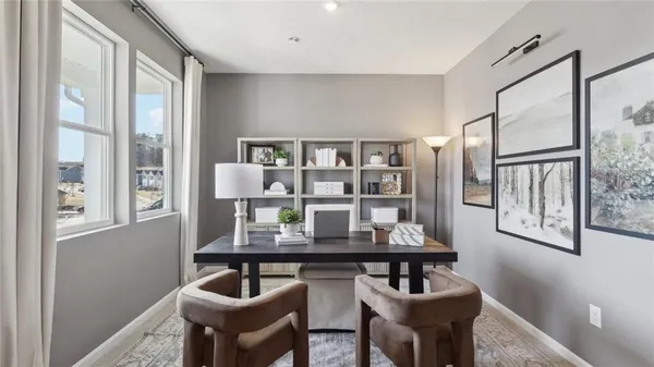 a dining room with furniture and window