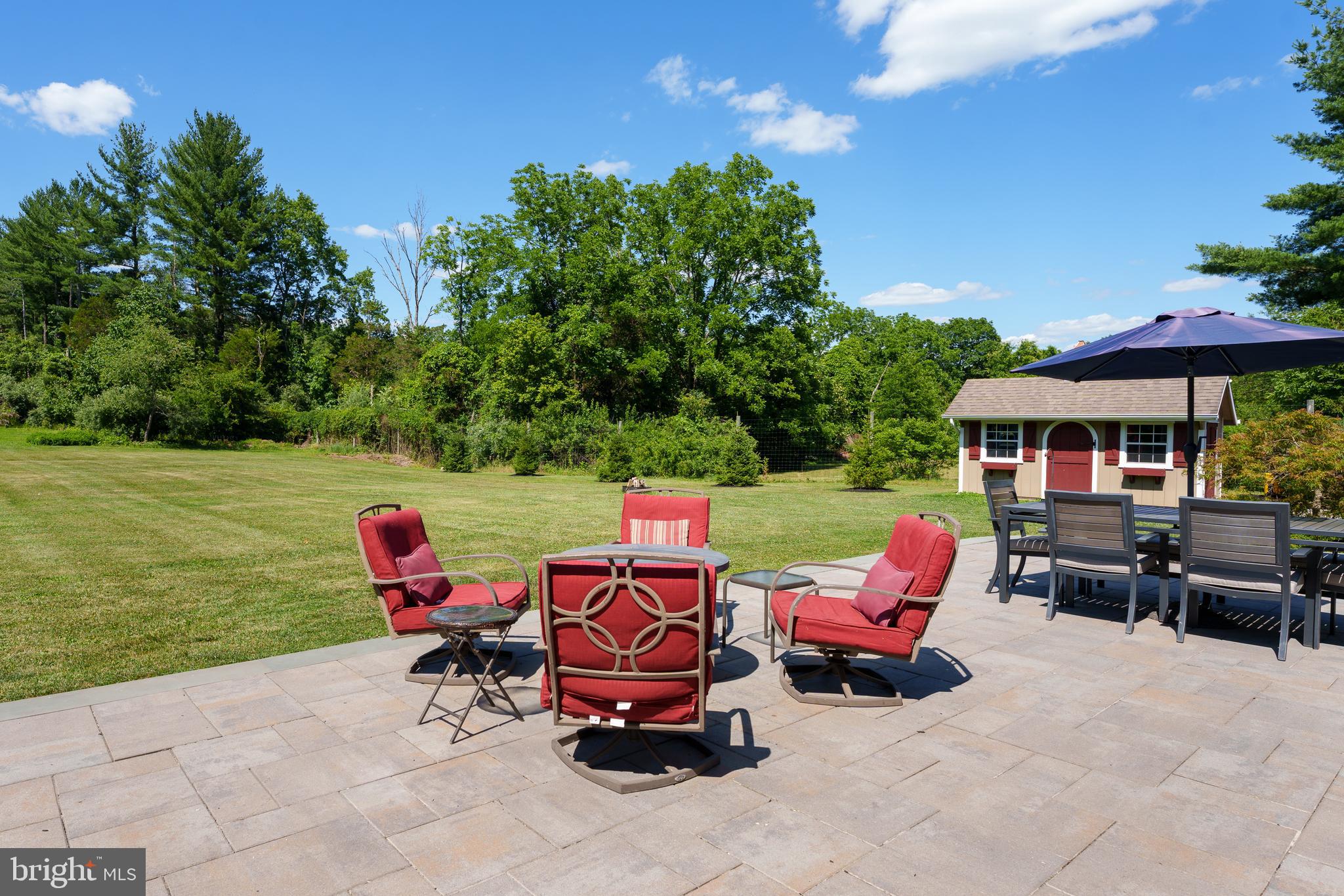 56 Valley Road Lambertville, NJ 08530 - Photo 47 of 49 a view of a patio with lawn chairs and a fire pit