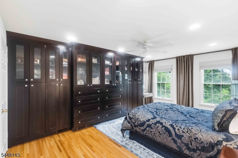 56 Union Hill Road Morris Plains, NJ 07950 - Photo 15 of 31 a bedroom with a bed vanity and a large window