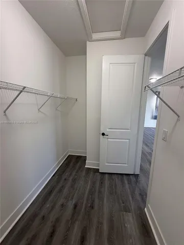 a bathroom with a bathtub sink and mirror