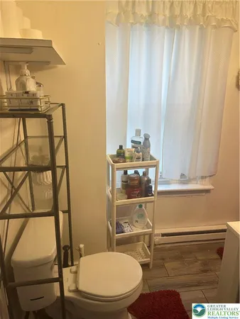 a bathroom with a toilet and a sink