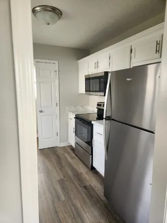 a kitchen with a refrigerator a sink and dishwasher